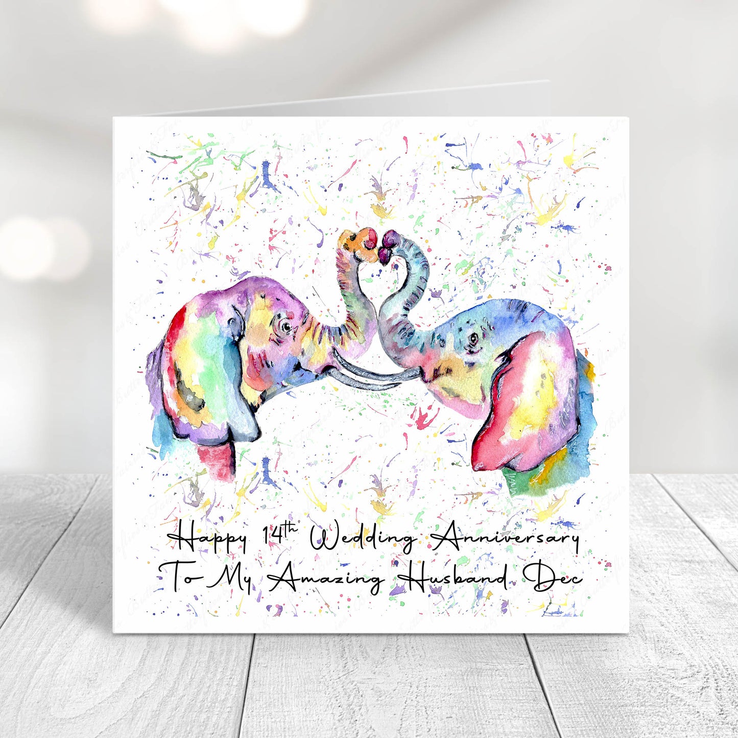 Colourful watercolour elephants forming a heart with their trunks on a 14th wedding anniversary card personalised for a wife or husband