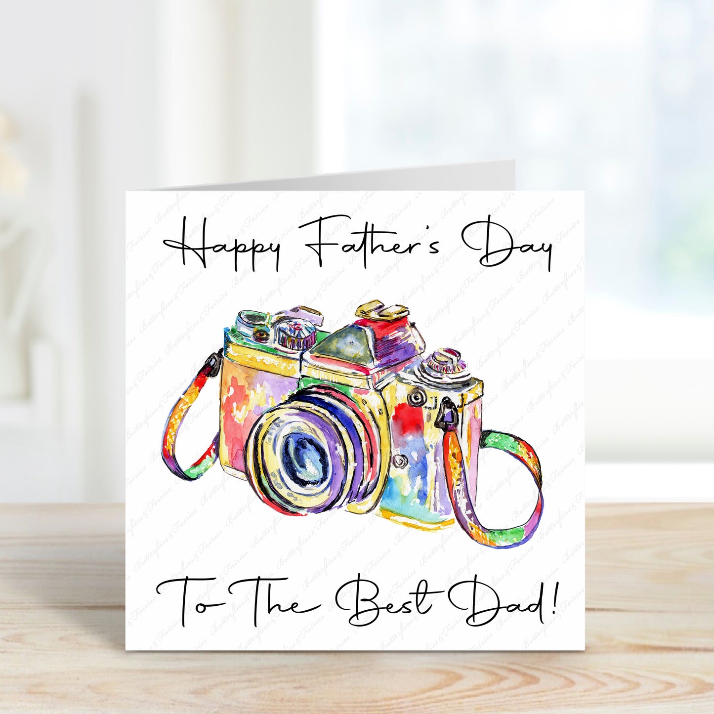 Square card with a colourful camera design with a plain white background