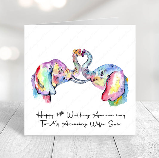 Colourful watercolour elephants forming a heart with their trunks on a 14th wedding anniversary card personalised for a wife or husband