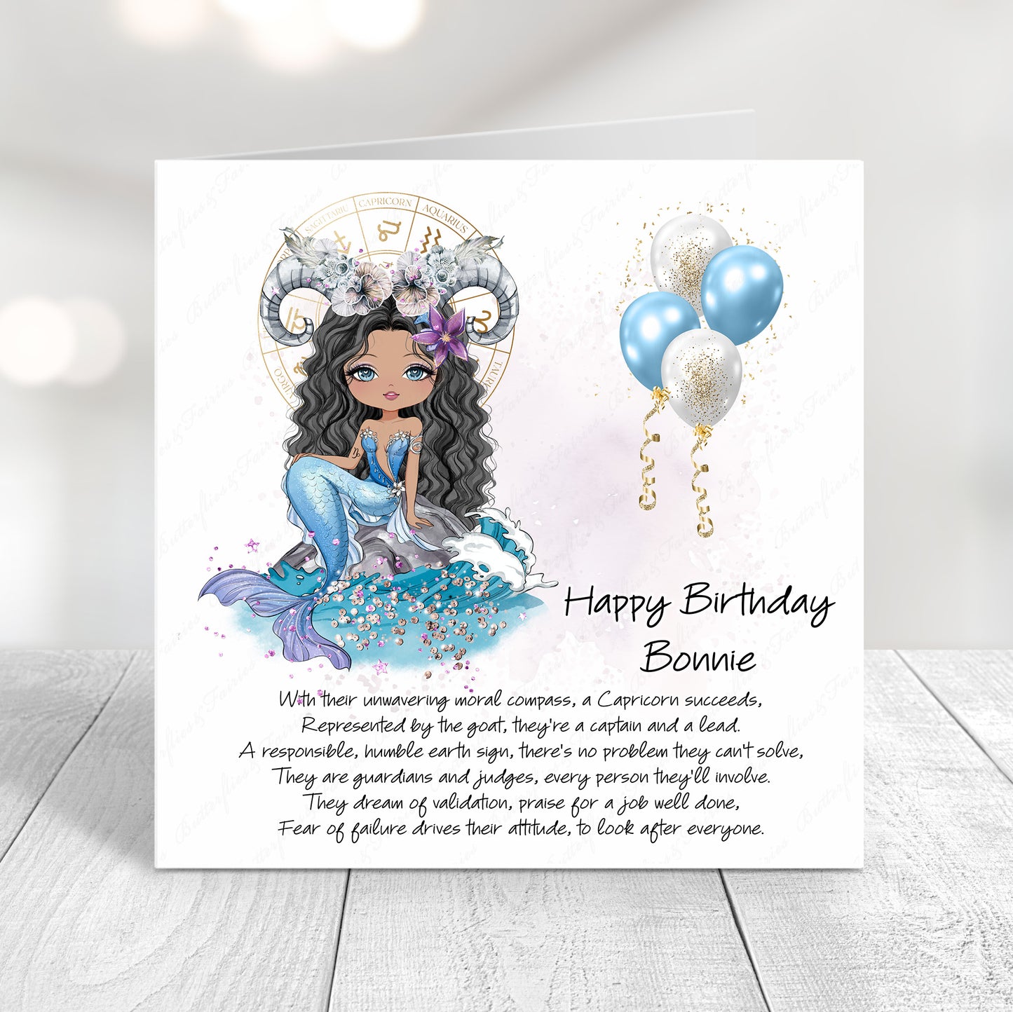 Personalised Capricorn zodiac birthday card with goat illustration, blue tones, and custom name on front