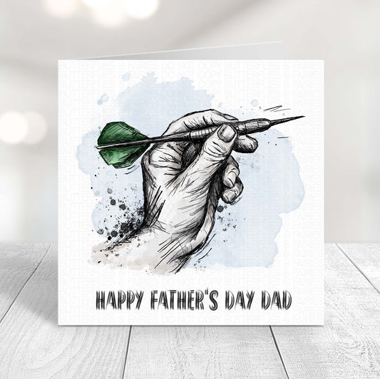 Darts Father’s Day card featuring a hand holding a dart with green flights, perfect for dad who loves darts