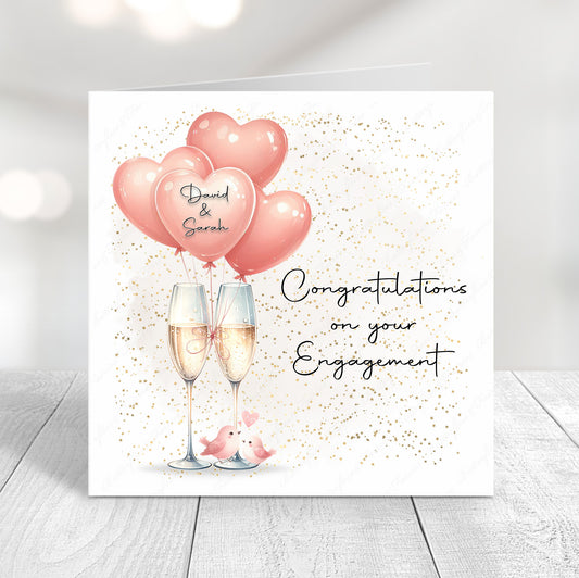 Personalised engagement card featuring champagne glasses, pink heart balloons with couple names and “Congratulations on your Engagement” message